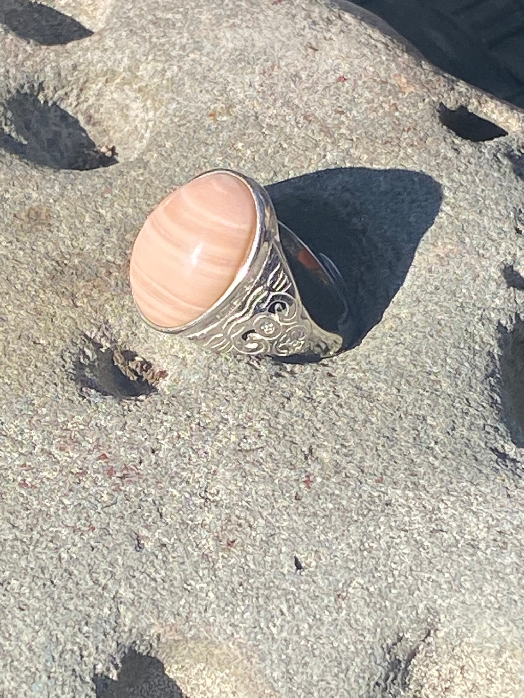 Natural Australian Pink Opal gemstone displaying distinctive color and polished finish