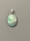 Natural Polish Chrysoprase Pendant showcasing unique gemstone color and pattern in a handcrafted pendant
