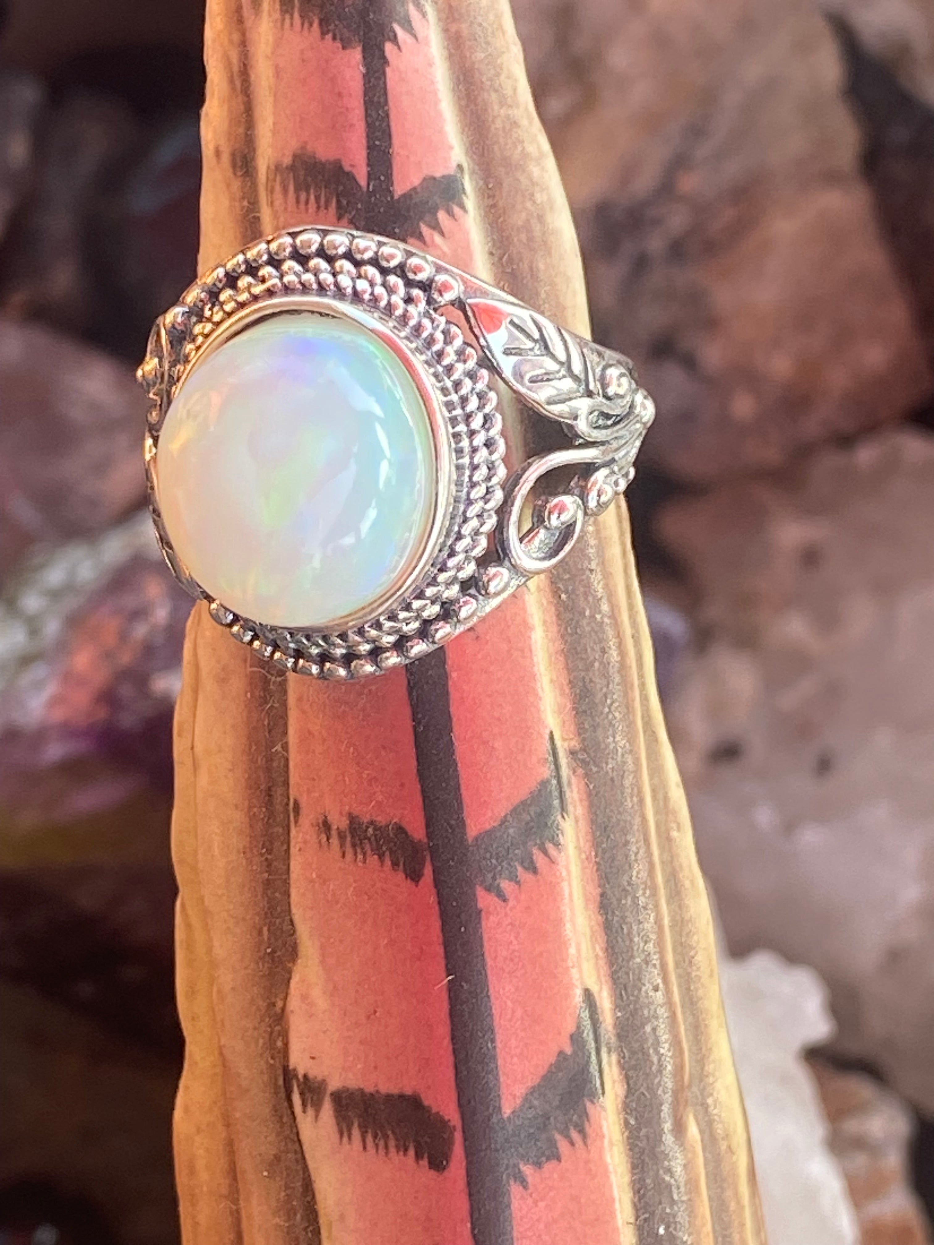 Natural 17-Carat Welo Opal Ring with Ornate Sterling Silver Setting gemstone ring, handcrafted jewelry featuring polished stone set in a decorative silver band