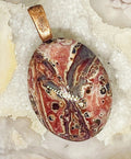 Natural Leopard Skin Jasper Pendant with Copper Bail gemstone pendant, handcrafted jewelry featuring polished stone with unique color and mineral patterns