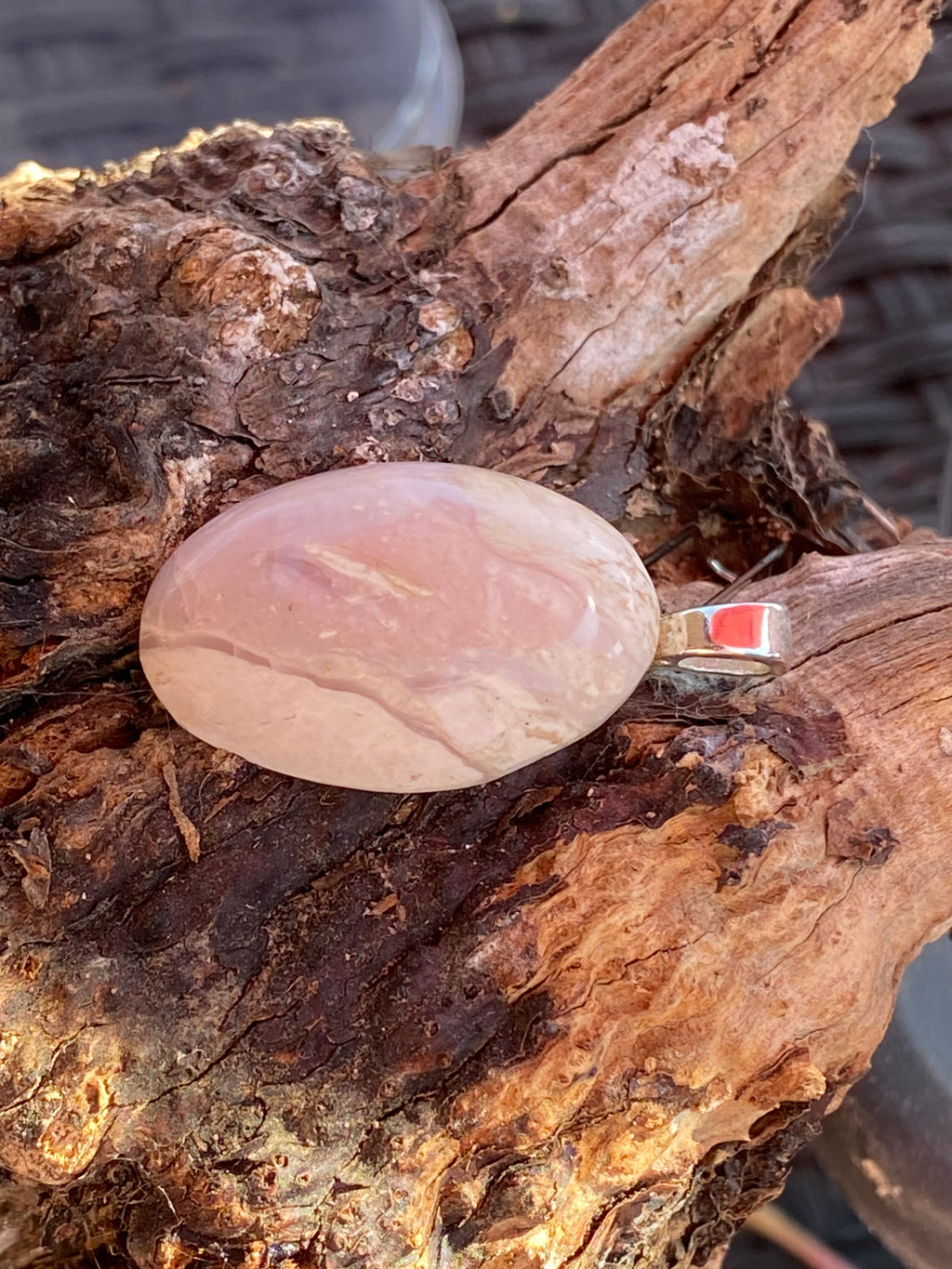 Natural Tanzania Pink Opal Pendent gemstone jewelry featuring polished stone with distinctive color, pattern, and handcrafted craftsmanship