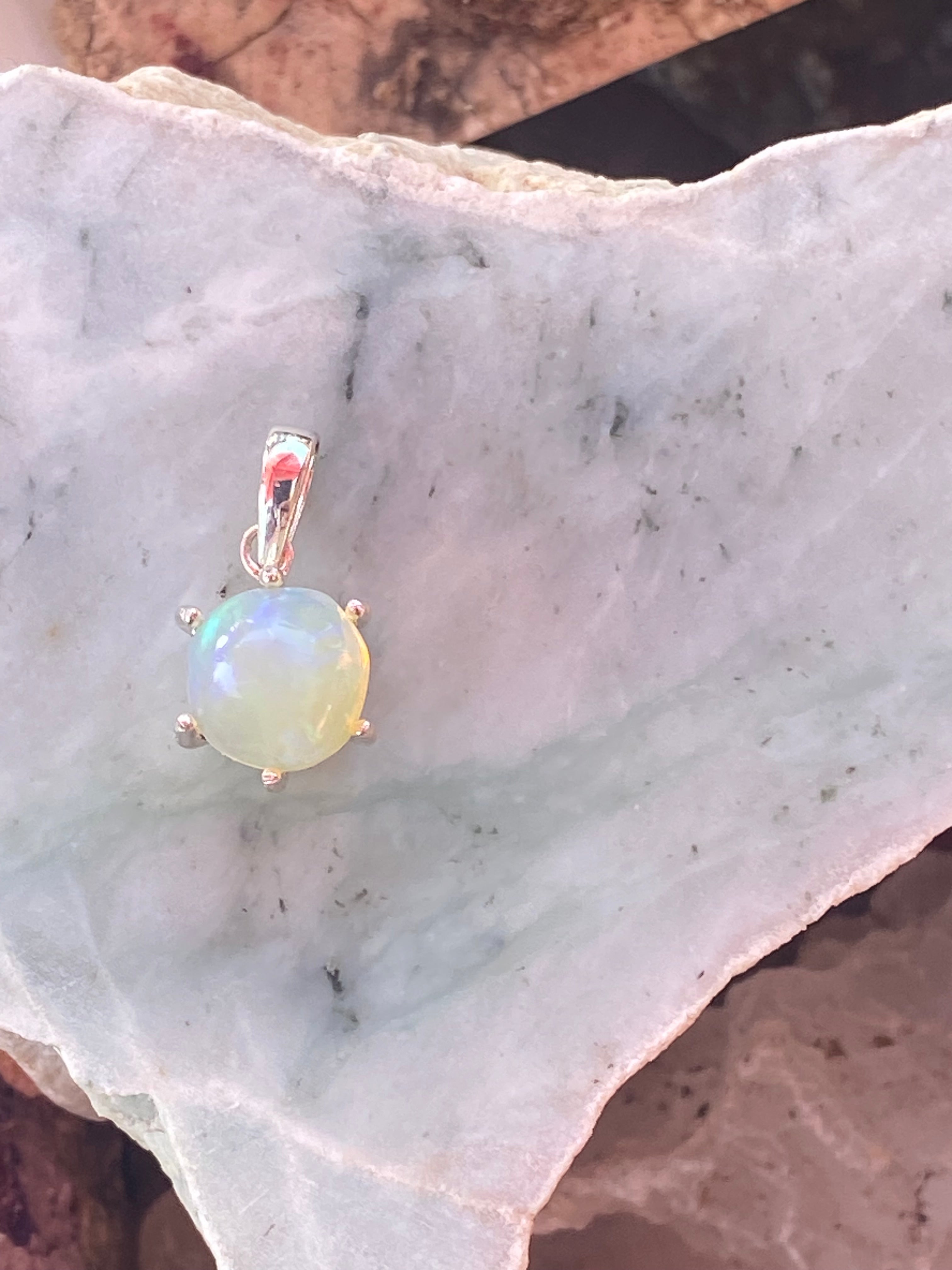 Natural Welo Opal in Sterling Silver Pendant gemstone pendant, handcrafted jewelry featuring polished stone with unique color and mineral patterns