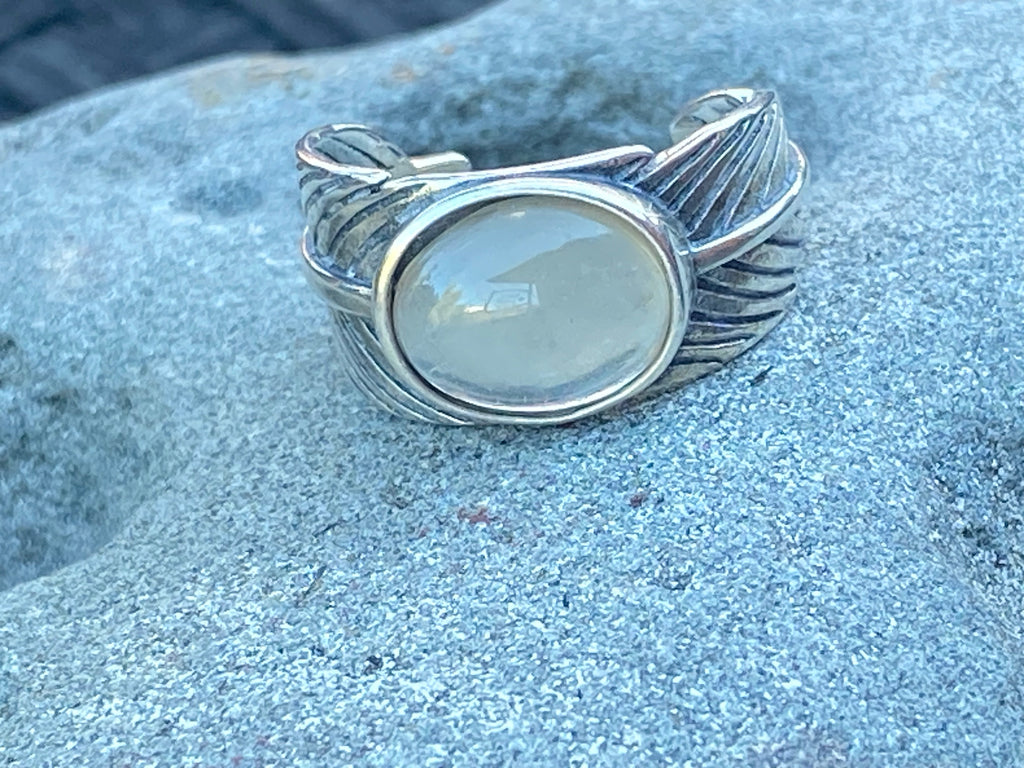 Natural Oregon Sunstone in leaf band gemstone jewelry with unique color, pattern, and handcrafted design