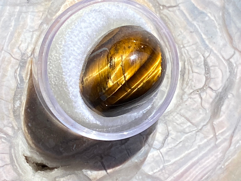 Natural Tiger Eye gemstone jewelry featuring polished stone with distinctive color, pattern, and handcrafted craftsmanship