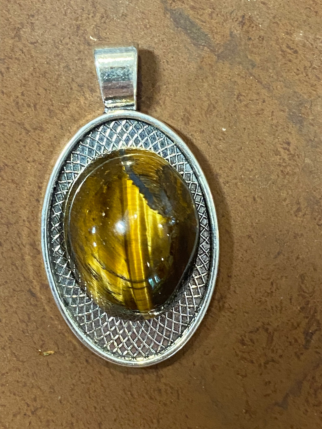 Natural Tiger Eye gemstone jewelry featuring polished stone with distinctive color, pattern, and handcrafted craftsmanship