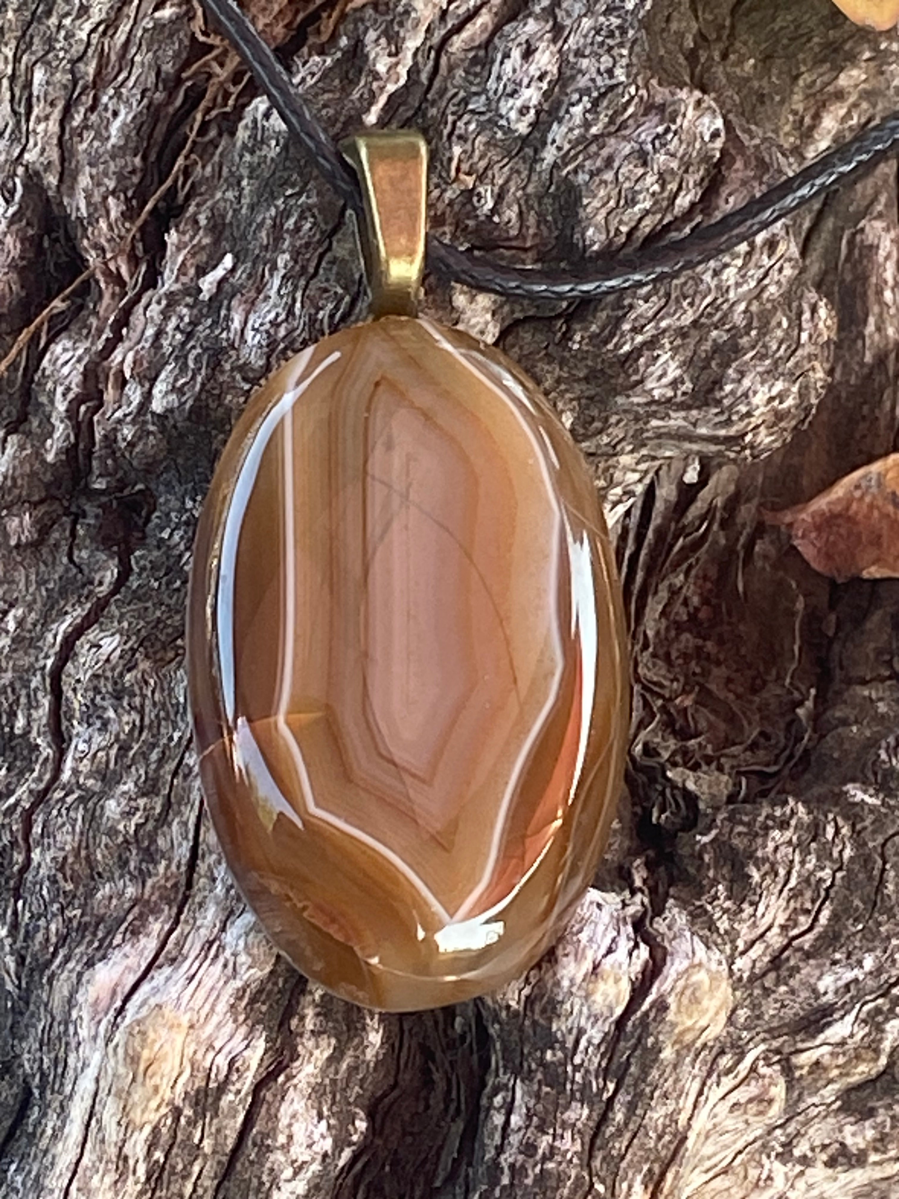 Natural Banded Agate Pendant gemstone pendant, handcrafted jewelry featuring polished stone with unique color and mineral patterns