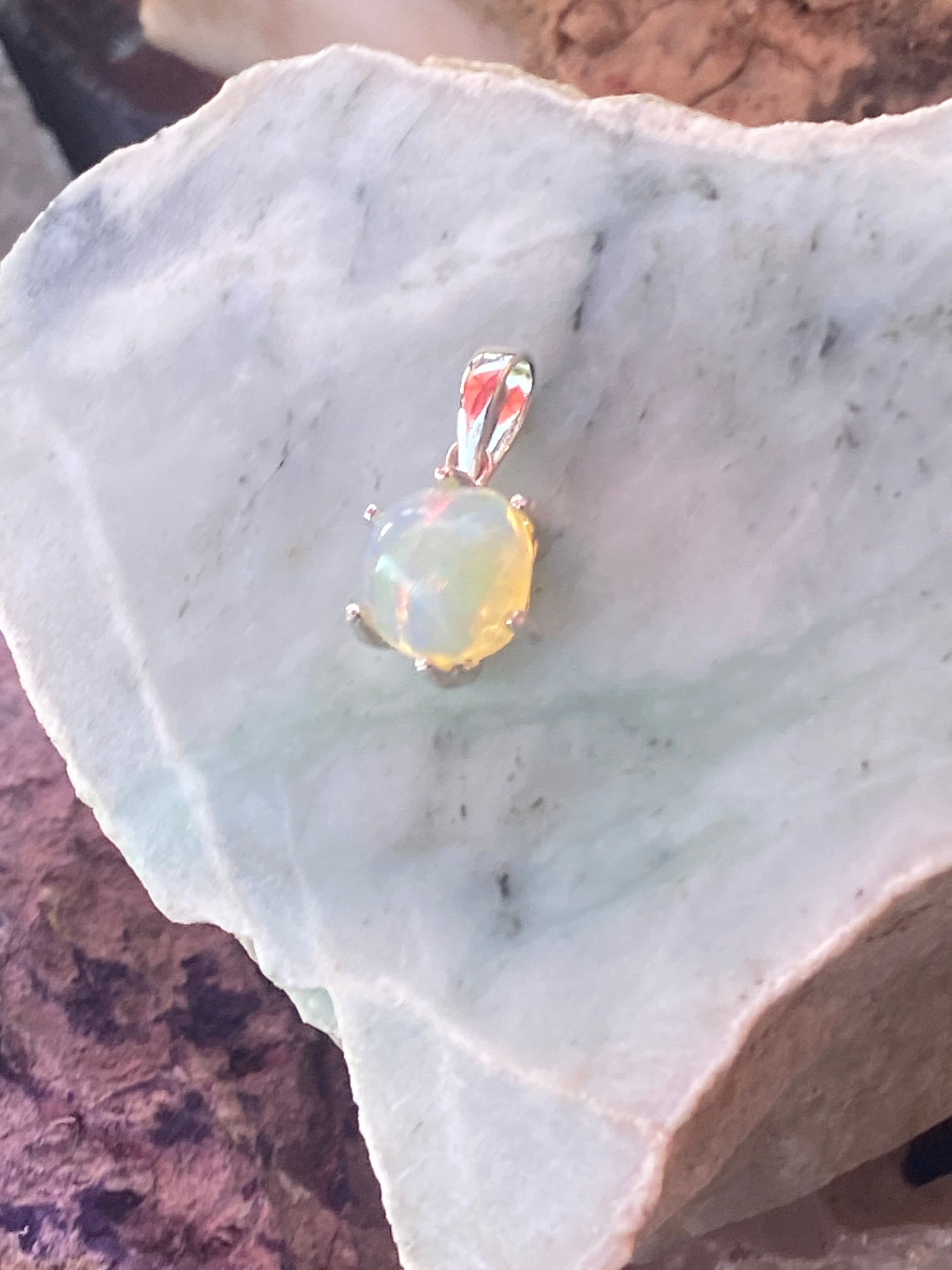 Natural Welo Opal in Sterling Silver Pendant gemstone pendant, handcrafted jewelry featuring polished stone with unique color and mineral patterns