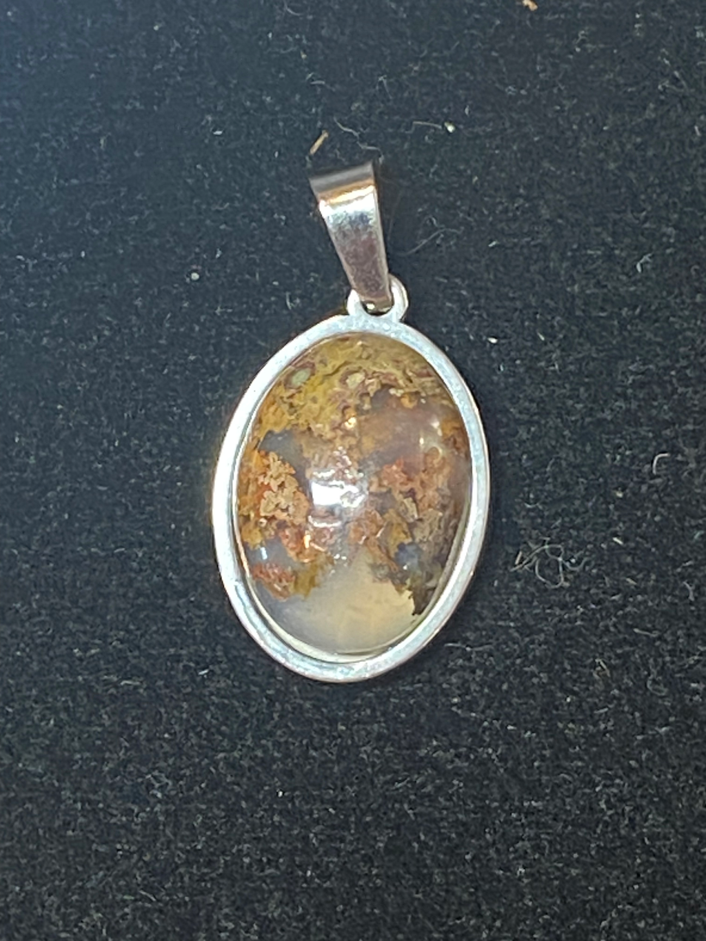 Natural Moss Agate gemstone jewelry featuring polished stone with distinctive color, pattern, and handcrafted craftsmanship