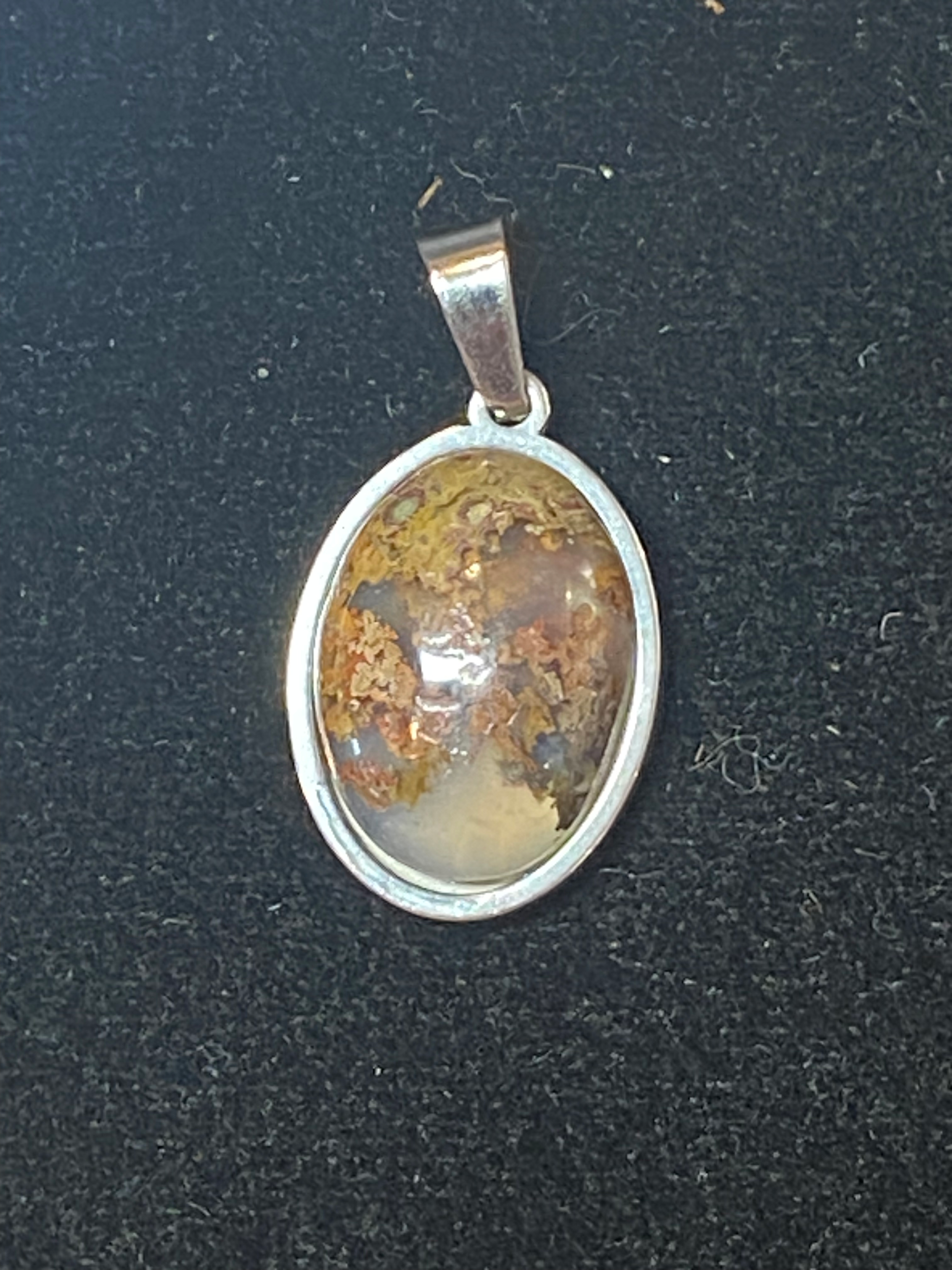 Natural Moss Agate gemstone jewelry featuring polished stone with distinctive color, pattern, and handcrafted craftsmanship