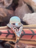 Natural 17-Carat Welo Opal Ring with Ornate Sterling Silver Setting gemstone ring, handcrafted jewelry featuring polished stone set in a decorative silver band