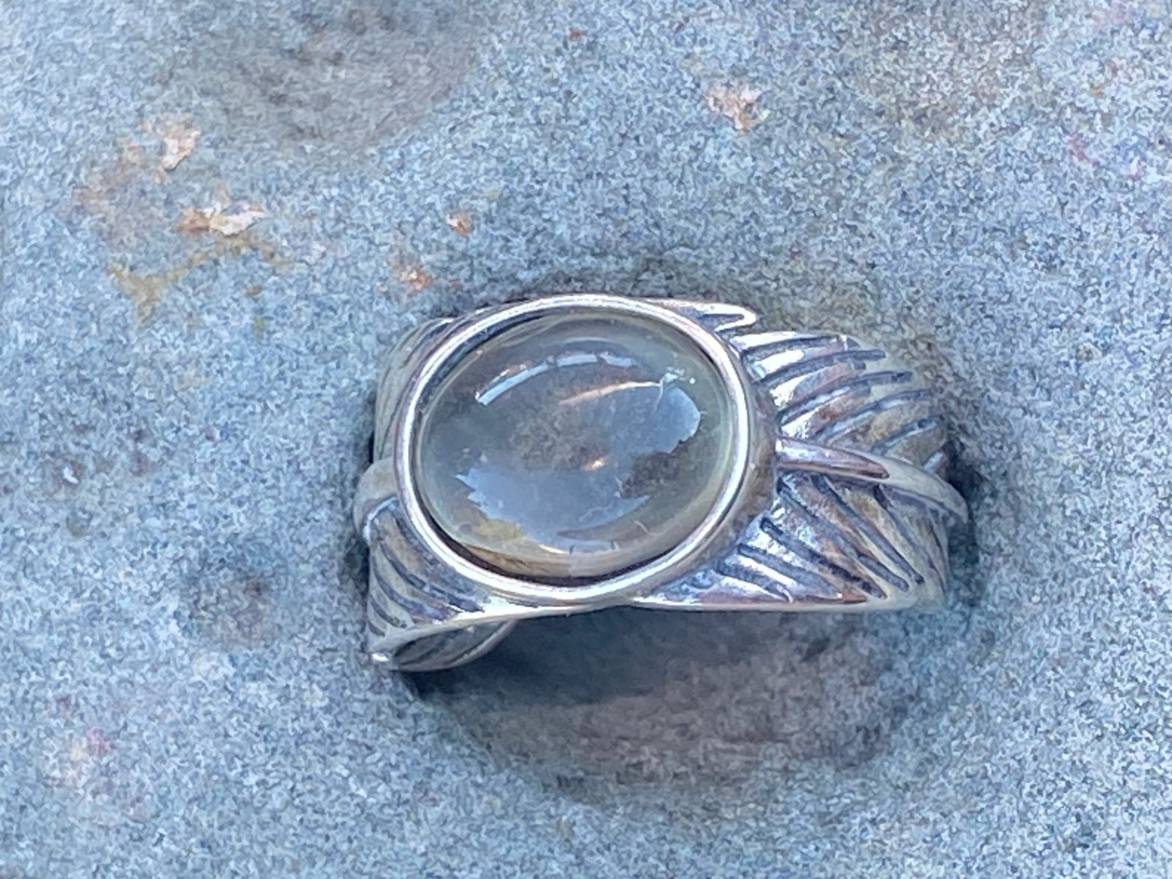 Natural Oregon Sunstone in leaf band gemstone jewelry with unique color, pattern, and handcrafted design
