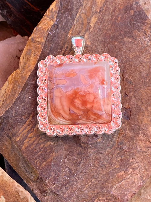 Pendant featuring Bubblegum Agate with pink, orange tones showing crystal, sparkle.