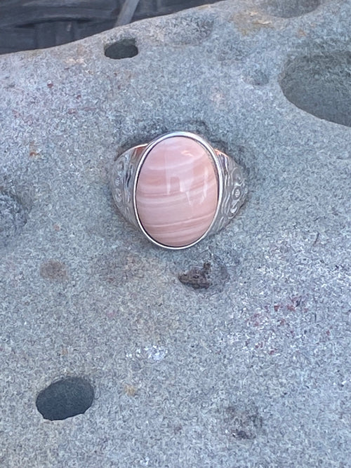 Natural Australian Pink Opal gemstone displaying distinctive color and polished finish