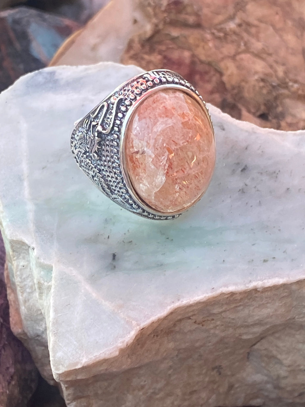 Natural Oregon Sunstone Ring with Intricate Dragon Motif in Sterling Silver gemstone ring, handcrafted jewelry featuring polished stone set in a decorative silver band