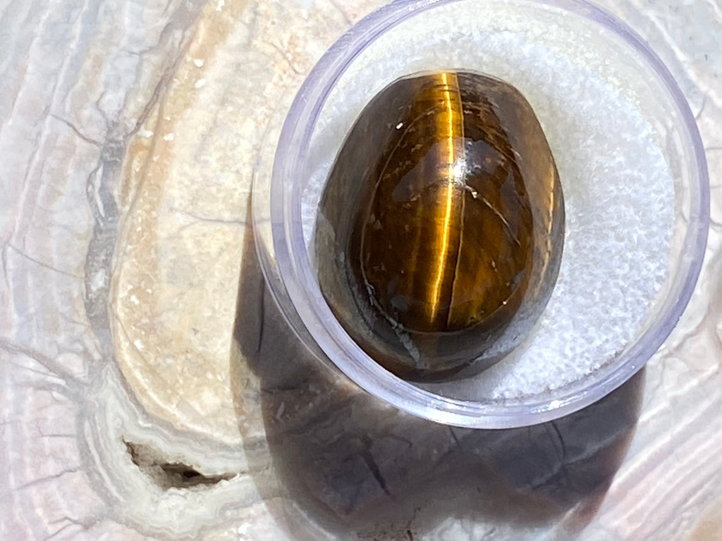 Natural Tiger Eye gemstone jewelry featuring polished stone with distinctive color, pattern, and handcrafted craftsmanship