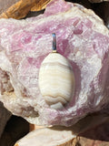 Natural Banded Agate Pendant gemstone pendant, handcrafted jewelry featuring polished stone with unique color and mineral patterns