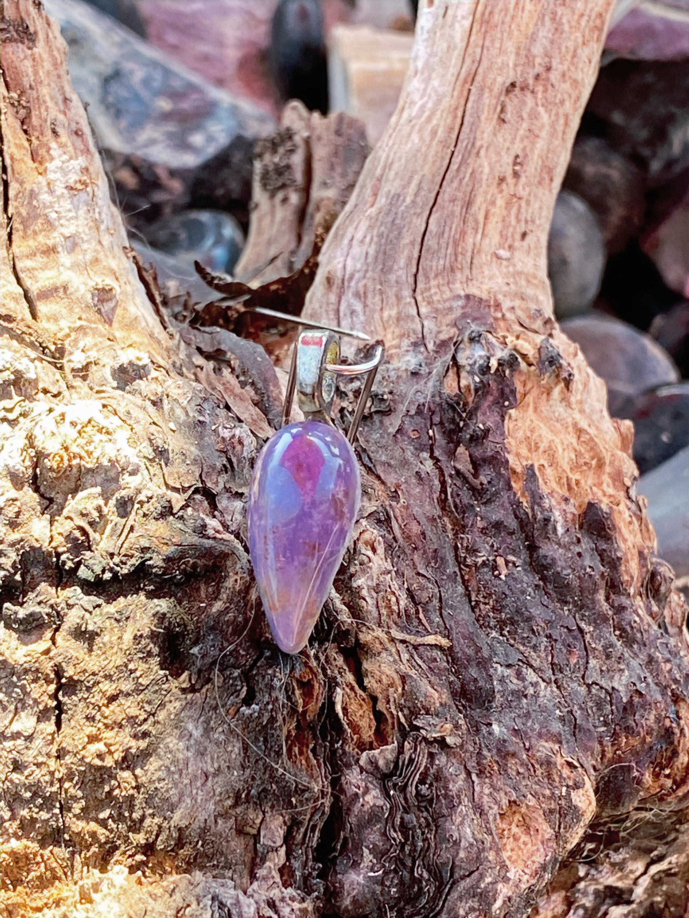 Natural Purple Agate Pendent gemstone jewelry featuring polished stone with distinctive color, pattern, and handcrafted craftsmanship