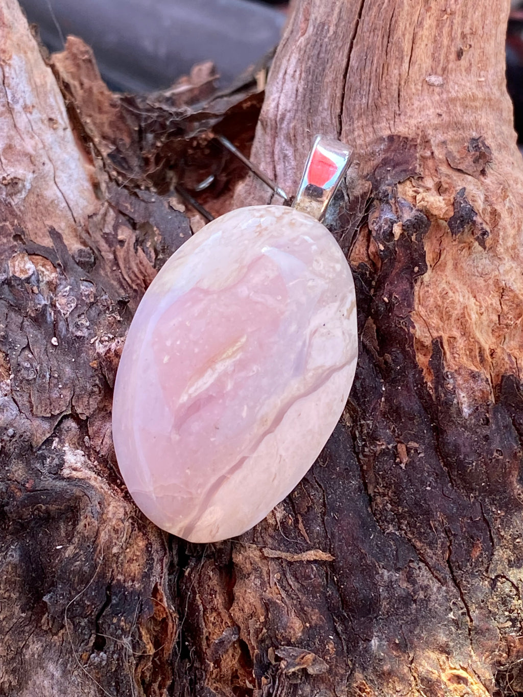 Natural Tanzania Pink Opal Pendent gemstone jewelry featuring polished stone with distinctive color, pattern, and handcrafted craftsmanship