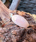 Natural Tanzania Pink Opal Pendent gemstone jewelry featuring polished stone with distinctive color, pattern, and handcrafted craftsmanship