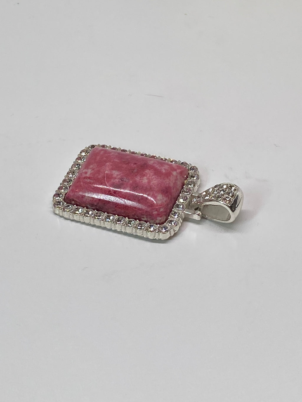Natural Thulite Pendant with Crystal Border on Silver-Plated Setting gemstone pendant, handcrafted jewelry featuring polished stone with unique color and mineral patterns