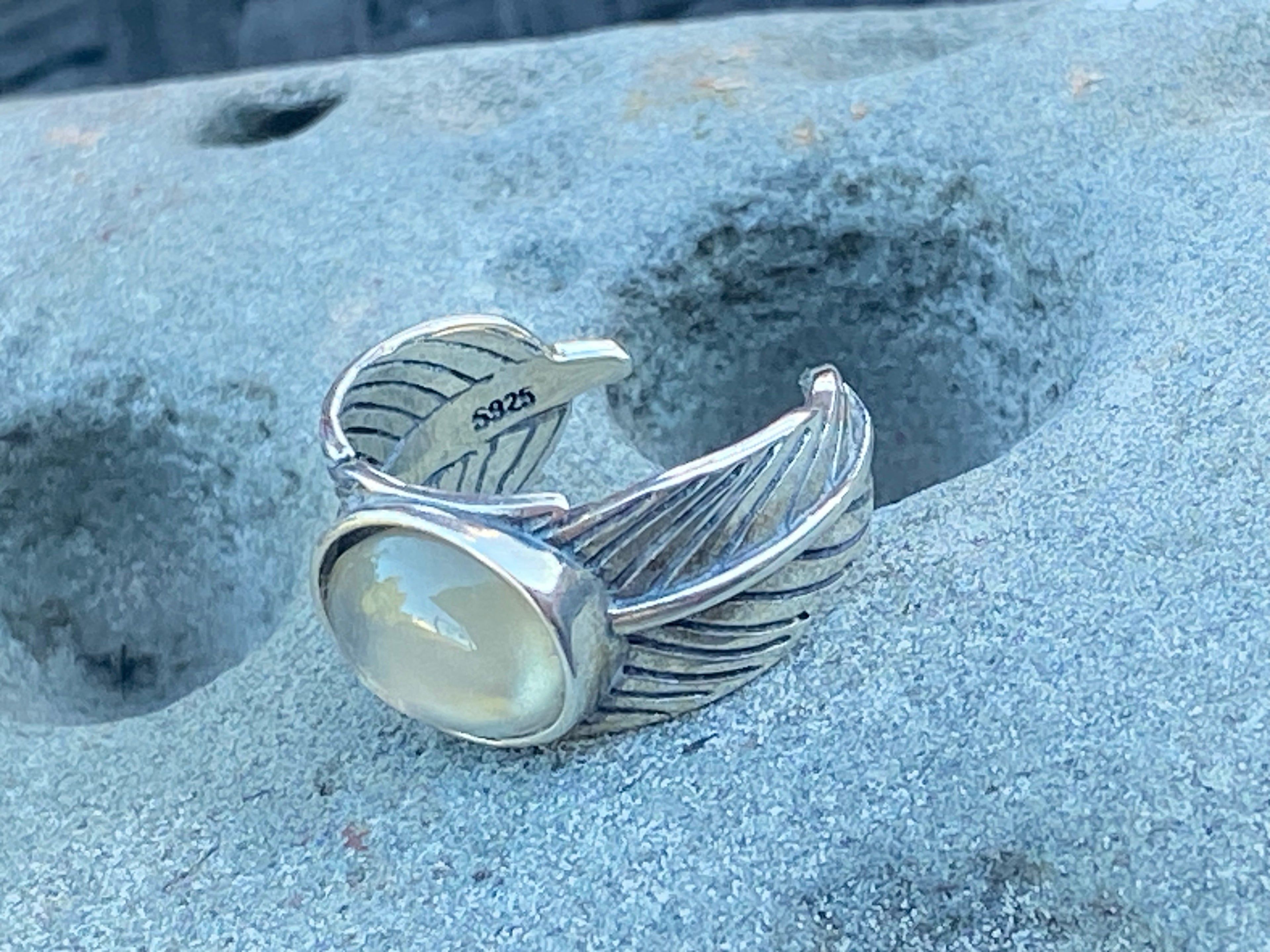 Natural Oregon Sunstone in leaf band gemstone jewelry with unique color, pattern, and handcrafted design
