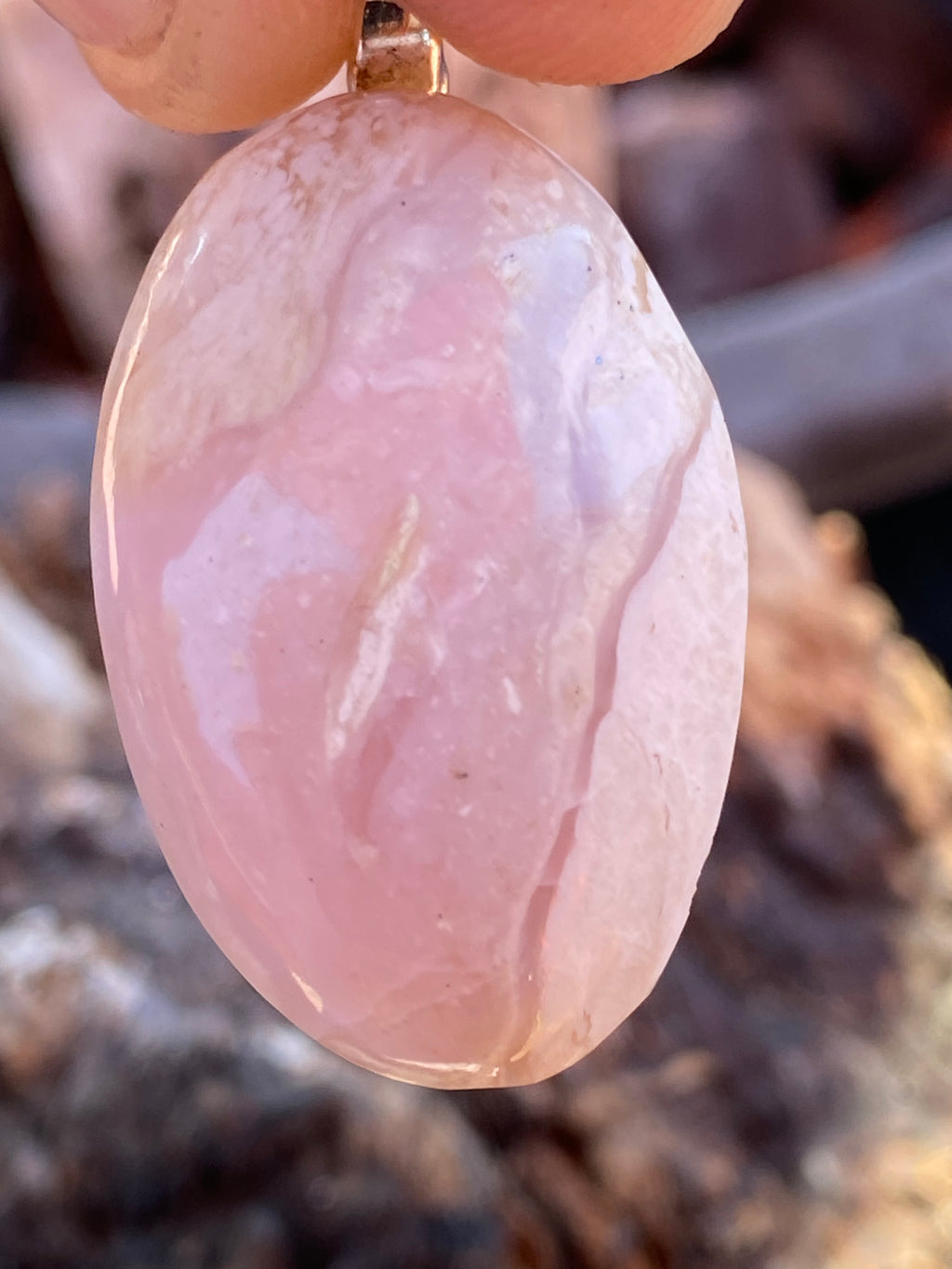 Natural Tanzania Pink Opal Pendent gemstone jewelry featuring polished stone with distinctive color, pattern, and handcrafted craftsmanship