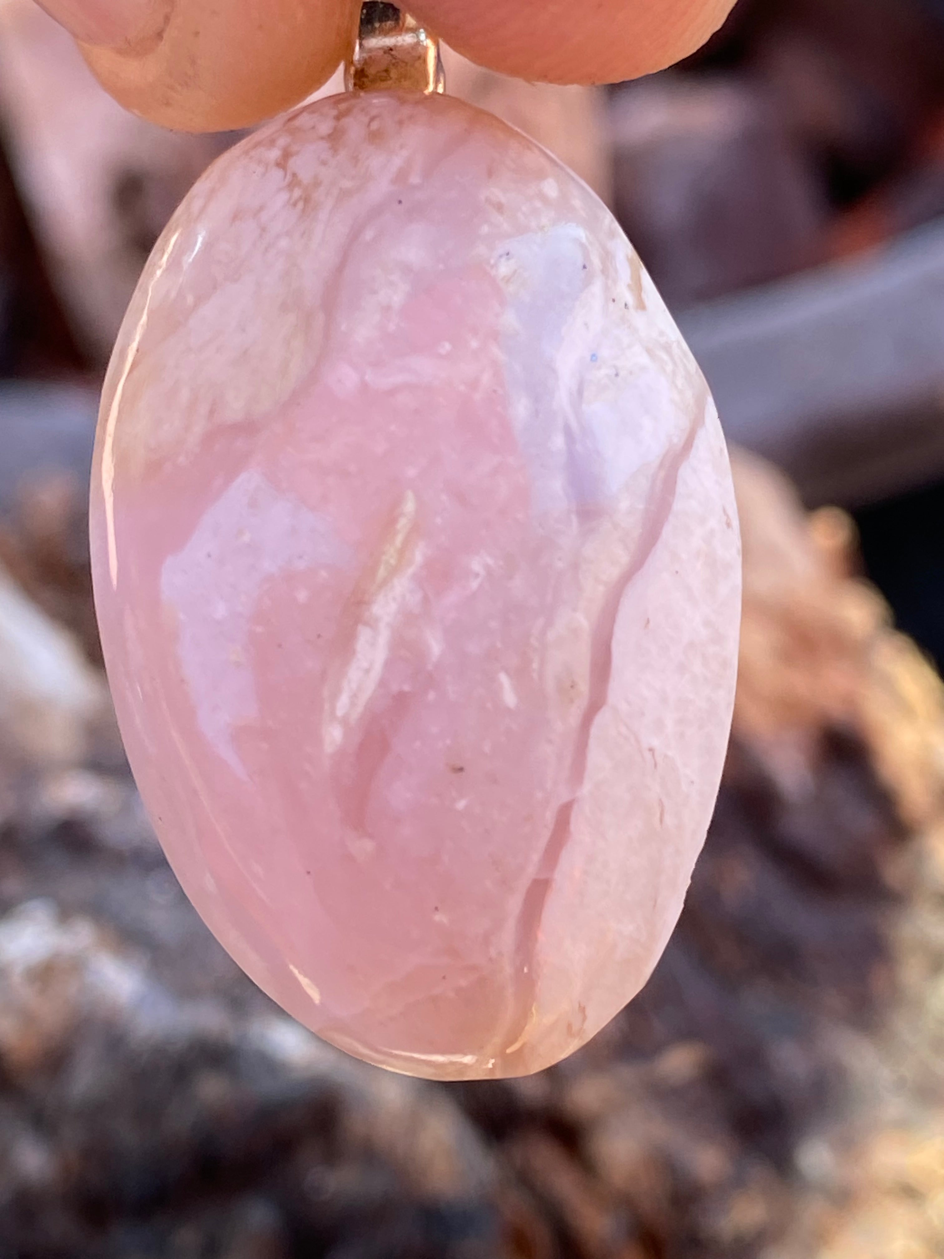 Natural Tanzania Pink Opal Pendent gemstone jewelry featuring polished stone with distinctive color, pattern, and handcrafted craftsmanship