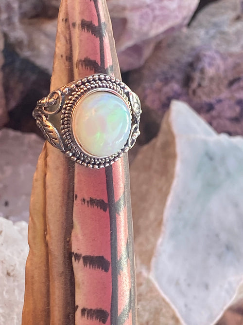 Natural 17-Carat Welo Opal Ring with Ornate Sterling Silver Setting gemstone ring, handcrafted jewelry featuring polished stone set in a decorative silver band